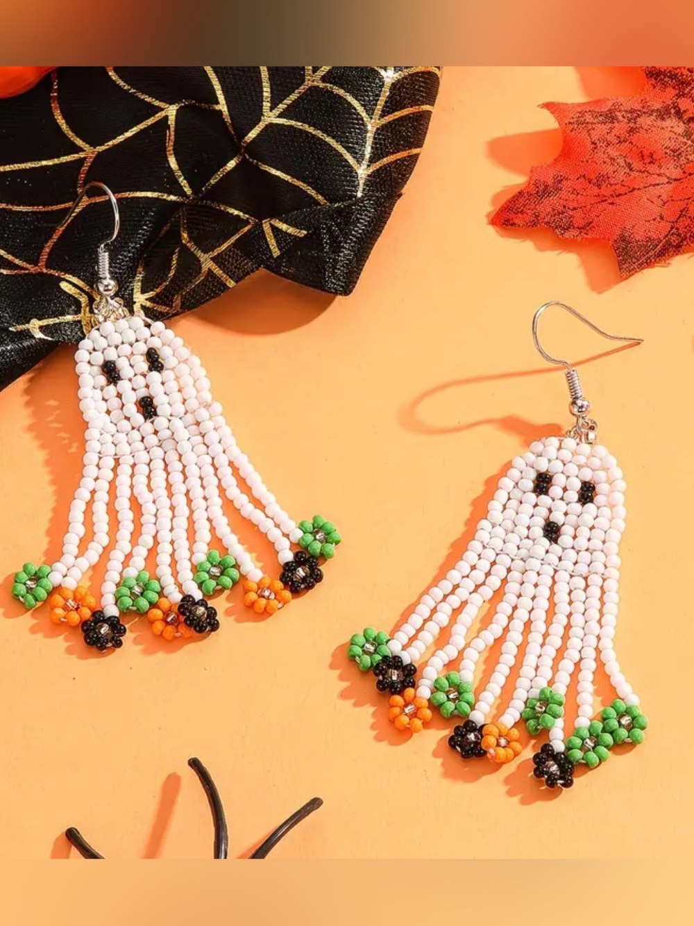 White Beaded Ghost Dangle Earrings with Orange & Green Accents